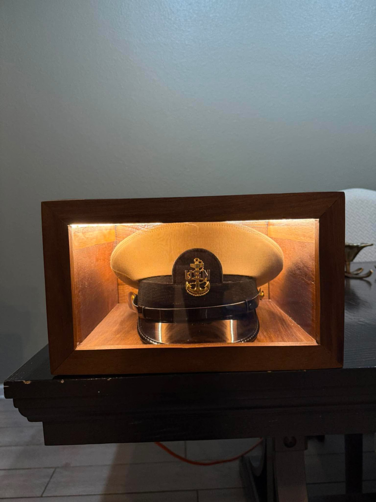 Lighted walnut military hat display case