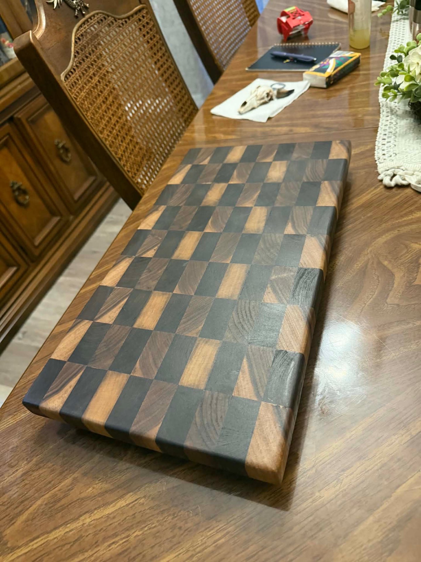 Black walnut end-grain cutting board on dining table